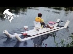 a man sitting on top of a boat in the water