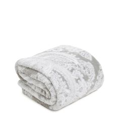 a white and grey blanket folded on top of each other