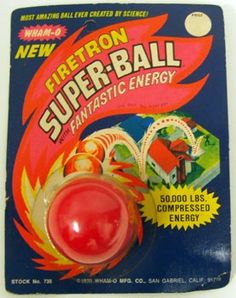 a red plastic ball is in front of a white box with the words super - ball on it