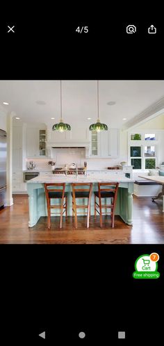 the kitchen is clean and ready to be used for cooking or dining room furniture, as well as an island with four stools