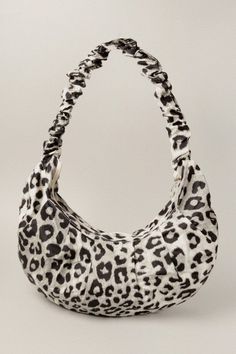 Accessorize with a statement shoulder bag that's luxuriously appointed with a leopard print. Ideal for both daytime or a night out. Leopard Print Ruched Top Handle Top Zip Closure Size: Approx. 16.5" W x 9"H Leopard Print Top Handle Shoulder Bag For Shopping, Leopard Print Top Handle Bag, Leopard Print Shoulder Bag With Animal Design, Elegant Leopard Print Bag With Gold-tone Hardware, Leopard Print Bag With Gold-tone Hardware And Top Handle, Ruched Top, Leopard Animal, Snow Leopard, Leopard Print