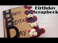 a happy birthday scrapbook with flowers and hearts on the cover is featured in this video