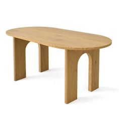 an oval wooden table sitting on top of a white floor