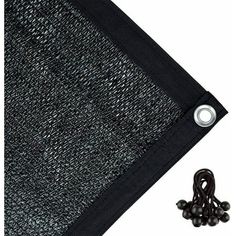 a black piece of fabric next to some beads