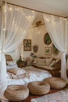 a bedroom with white curtains and lights on the ceiling, wicker baskets under the bed