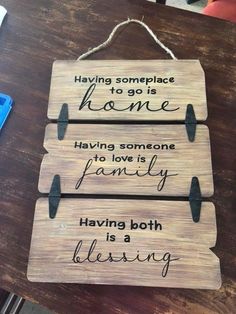 a wooden sign that says having some place to go is home having someone to love is family having both blessing