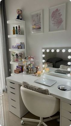 a white desk topped with a mirror and lights