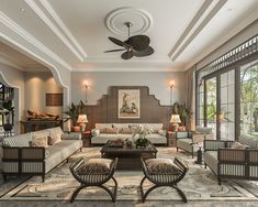 a living room filled with furniture and lots of windows