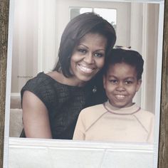 the first lady and her daughter pose for a photo