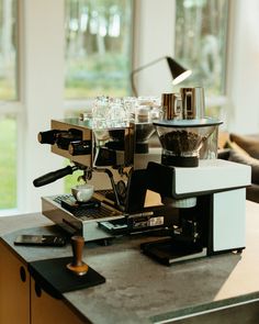 an espresso machine sitting on top of a counter