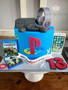 a birthday cake that looks like it has been made to look like the playstation logo