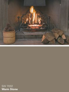 a fire place with logs in front of it