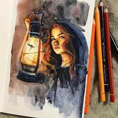 a watercolor painting of a girl holding a lantern and two colored pencils next to it