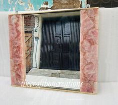 the door is made out of pink marble