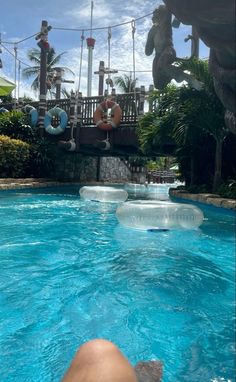 someone is swimming in the pool with an inflatable raft