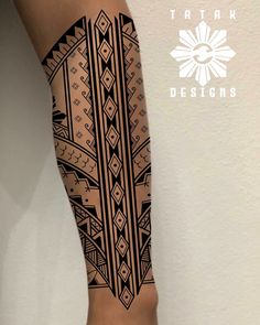 a woman's arm with an intricate tattoo design on the side of her leg