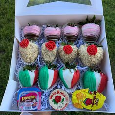 a box filled with lots of different flavored strawberries