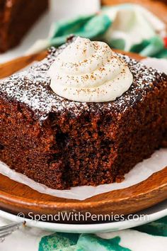 a piece of chocolate cake with whipped cream on top