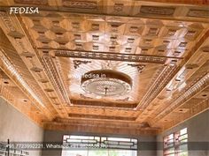 the inside of a building with wooden carvings on the ceiling and windows in the center