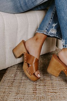 The perfect summer shoe just dropped! Our boho 'Mellow' heel features two wide brown faux leather crossed over-the-foot straps, a rounded open toe, a platform sole with a block heel, and a chunky slip-on silhouette! - This heel runs more true to size. - Heel Height: 3.5 inches Summer Shoe, Impressions Online Boutique, Faux Leather Heels, Clogs Shoes, Perfect Summer, Summer Shoes, Leather Heels, Online Boutique, Block Heels