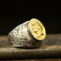 Ancient Roman Art Caesar Gold Coin Signet Ring | Two Tone King Ring | 925 Sterling Silver Ring | Roman Art Ring | Mythology Ring  Handcrafted hammered  ring Metal : 925 Sterling SilverCoin  : Reproduction Bronze CoinPlated : 24K Gold Ring Size : 30 x 18 mmCoin  Size : 16.4 mmRing Weight : 14 gramsRing Size : US 10 (The size you want is made for free).(We used the US standard sizing) **Custom Orders is Made**As pellada family, we will be happy to help you if you contact us with the photo and dime