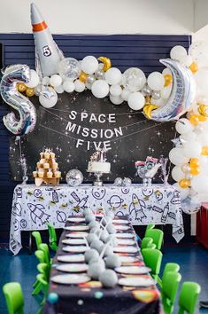 a space mission themed birthday party with balloons