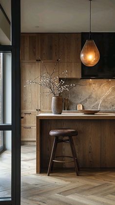 a kitchen with wooden cabinets and stools