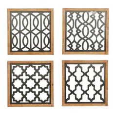 four metal wall art pieces with wooden frames on the sides and one has an intricate design