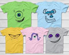 four t - shirts with cartoon faces on them, all in different colors and sizes