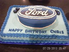 a birthday cake with the ford logo on it