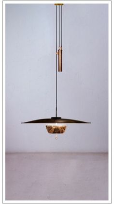 a modern light fixture hanging from the ceiling