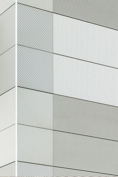 the side of a building with lines painted on it