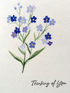 a watercolor painting of blue flowers with the words thinking of you written on it