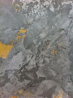 yellow and gray paint on the surface of concrete