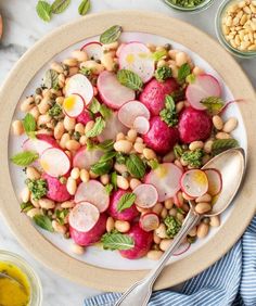 a white plate topped with radishes and beans