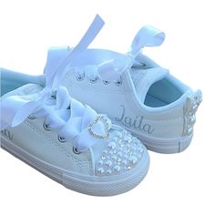 Perfect for a flower girl or other important event. Different sizes of pearls are used and silver/clear crystals are added as well. So much sparkle! The backs are done as well with crystals and pearls and a silver rhinestone heart is added to the white ribbon ties. These leather shoes run big so you most likely will need to size down. White Closed Toe Canvas Shoes, White Canvas Closed-toe Shoes, Cute White Canvas Shoes, All White Converse, Converse Baby, White Slip On Sneakers, Toddler Converse, Flower Girl Shoes, Girls Converse