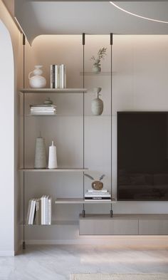 a living room filled with furniture and a flat screen tv sitting on top of a wooden shelf