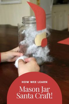 someone is making a paper santa hat out of yarn and cotton in a mason jar with text overlay that reads, how we learn mason jar santa craft