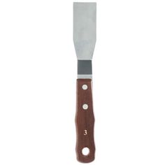 a knife that is sitting on top of a white surface with holes in the blade