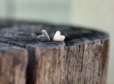 Add a touch of cute to any outfit with these sweet heart stud earrings!-d e s c r i p t i o n-These are handmade from scratch from solid sterling silver!  It involves melting the sterling & rolling into a sheet.  I then saw the hearts out using my jewelers saw & solder the ear pins to the back.No two hearts are the same, but will be just as cute as these I promise!  They measure around 6mm high & 5mm wide & come in a shiny mirror finish.Need a matching ring? Well here you go..htt Tiny Heart Earrings, Ear Pins, Etsy Bridesmaid Gifts, Stud Jewelry, Tiny Heart, Matching Rings, Two Hearts, Heart Studs, Heart Earrings Studs