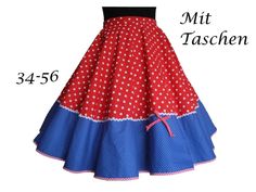 a red and blue polka dot skirt with white dots on the bottom, in front of a