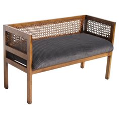 a wooden bench with grey cushions on it