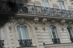 an ornate balcony and balconies on the side of a building