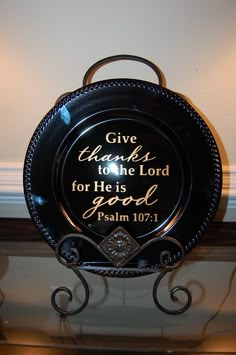 a black plate with the words give thanks to the lord for he is good