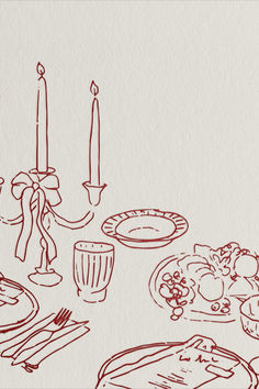 an image of a table setting with food and candles in the background on white paper