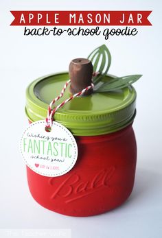 an apple mason jar with a tag attached to it