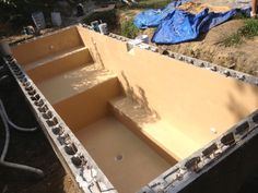 an unfinished boat is being built in the yard