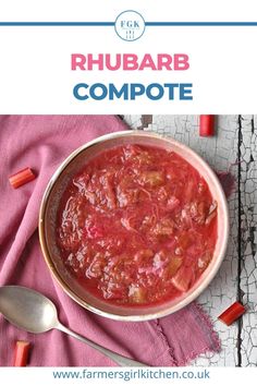 a bowl of rhubarb compote on a pink towel with spoons