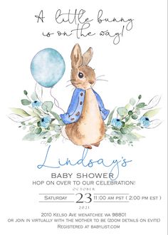 a baby shower is shown with an image of a bunny holding a blue balloon and flowers