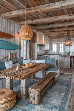 a wooden table sitting in the middle of a living room next to a blue rug